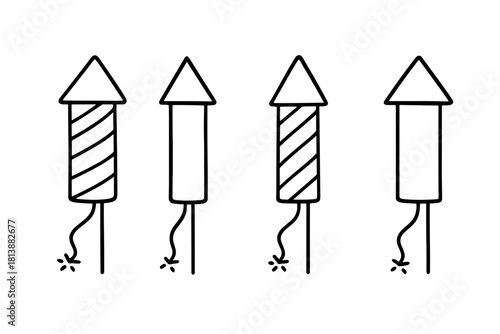 Four simple black and white firework rockets with lit fuses for celebration