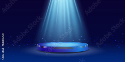 Round blue stage illuminated by bright beam.