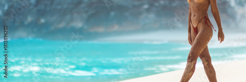 Εκτύπωση καμβά Topless Woman In Red Bikini Bottom Walking On Beach With Sandy Tanned Legs