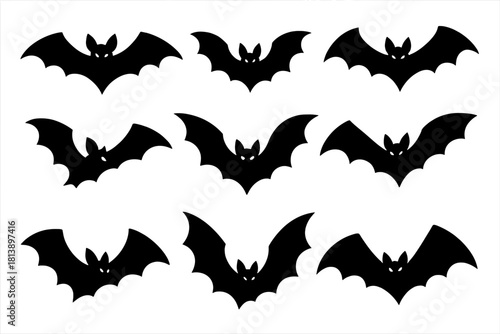 Nine black flying bat silhouettes set against a white background for Halloween decoration