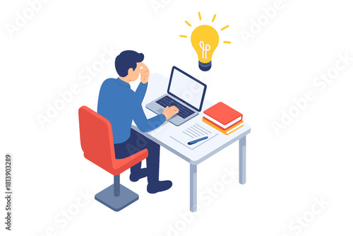 Creative businessman working on a laptop at a desk having a sudden bright idea