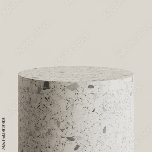 Cylindrical terrazzo pedestal with neutral background
