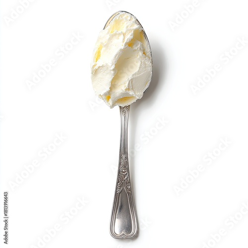 Creamy spread atop a vintage spoon