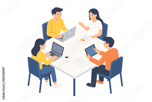 Diverse business team collaborating around a white table using digital devices in a modern setting