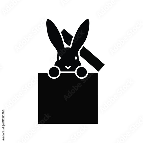 Black rabbit peeking from gift box magic surprise cute animal isolated on white background