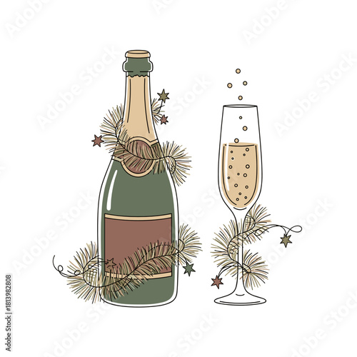 Sparkling wine bottle and glass decorated with festive greenery  