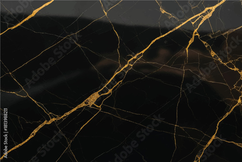 Luxurious black marble surface with striking veins of metallic gold evoking elegance and sophistication for high end interior design applications