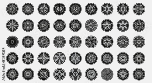 Image shows a collection of varied monochrome car wheel rims arranged in a gridlike pattern against a plain background