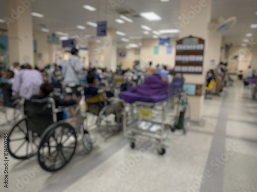 Many patients sit and lie on wheelchairs and stretchers in the hospital.