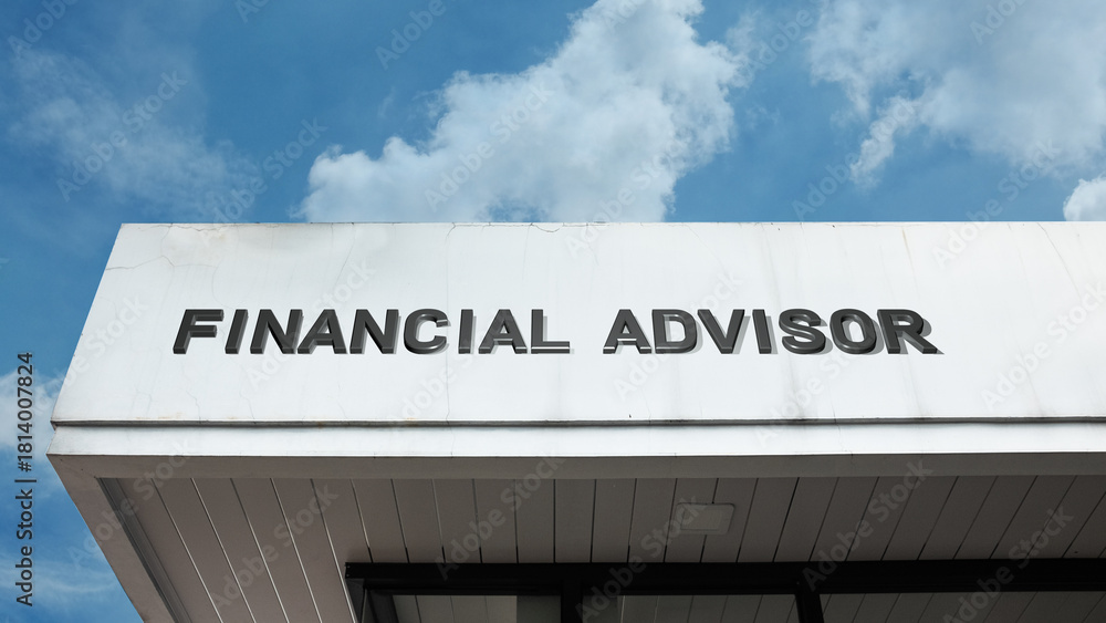 Obraz premium Financial Advisor sign displayed on a building against a clear blue sky, symbolizing investment guidance, wealth management, economic planning, expert consultation, and security