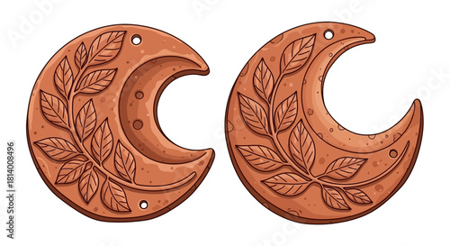 Two clay crescent moons with leaf designs each featuring small holes