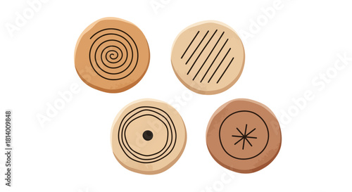 Four tan circular objects feature varying black geometric designs