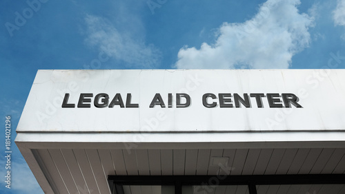 Legal Aid Center sign on a building against a clear blue sky, symbolizing free legal services, public assistance, justice for all, community support, and rights
