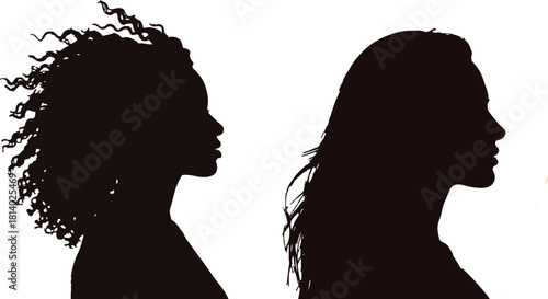 Silhouette Profile of Two Women with Contrasting Hair Styles