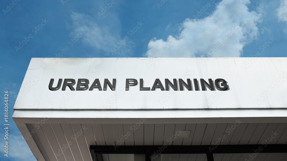 Obraz premium Urban Planning word signage on a municipal building under a blue sky, symbolizing city development, policy, future design, zoning, sustainability, and infrastructural growth