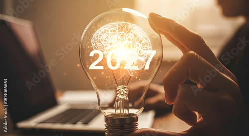 Illuminated Light Bulb with Brain and Year 2027 Symbolizing Innovation and Future Ideas.