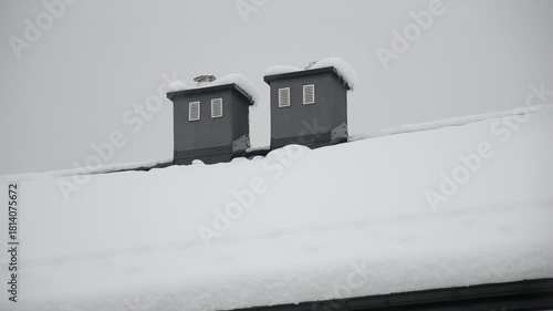 Snow-Covered Roof with Chimneys in Winter