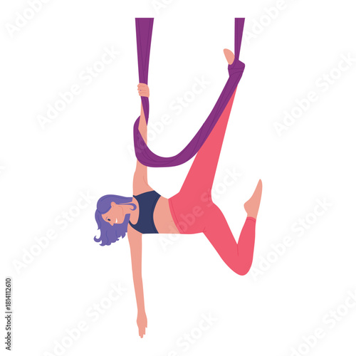 A skilled woman gracefully performs a dynamic aerial yoga pose, showcasing both strength and incredible flexibility
