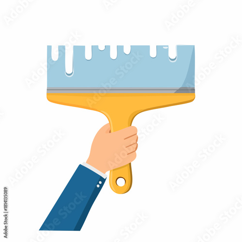 Ambiance bricolage, gros plan sur une main qui étale de l'enduit sur un mur avec une spatule, ou taloche, rénovation, travaux