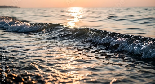 Fototapeta Naklejka Na Ścianę i Meble -  Ocean wave washing onto shore at sunset