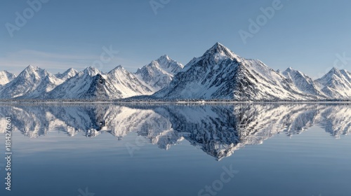 Wallpaper Mural Majestic snow-covered mountains reflecting on crystal clear lake at dawn with serene blue skies in the background Torontodigital.ca