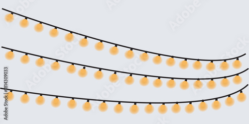 Three strands of glowing orange string lights on a gray background