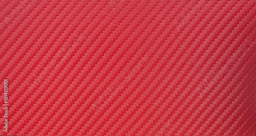 Photo of the texture of red sports carbon fiber.Red background for tuning.