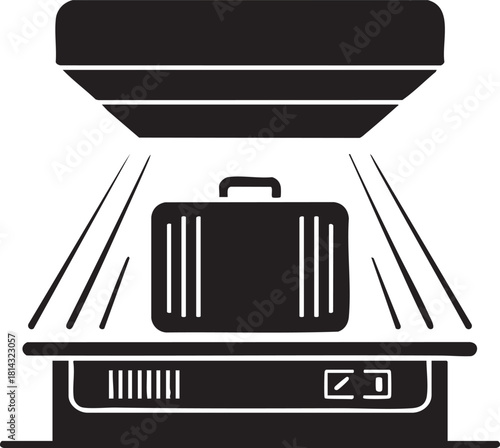 An airport security scanner checks a black suitcase through its x ray machine process
