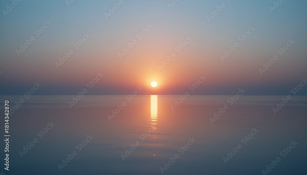 Fototapeta premium Soft sunrise glow reflecting on a smooth glass surface