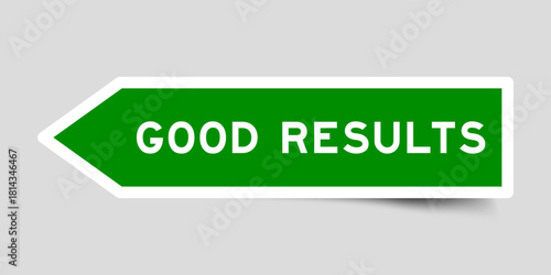 Green color arrow shape sticker label with word good products on gray background