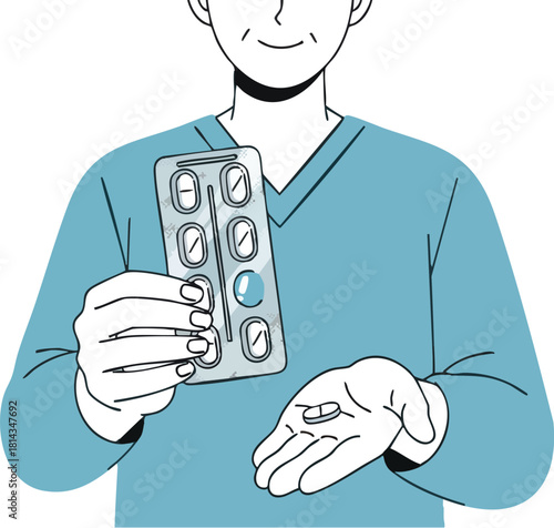 Man holding medicine blister pack and pill in hand for health treatment.