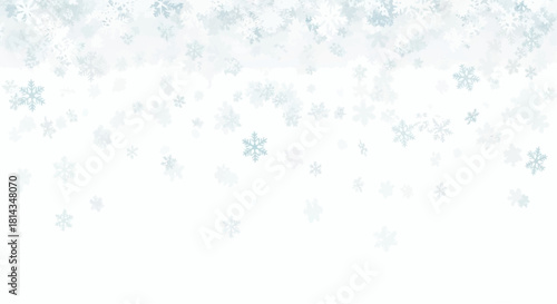 A delicate snowfall of pale blue snowflakes gently falling against a bright white winter background scene