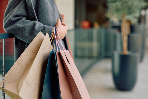 Fotografi Woman carrying various shopping bags, enjoying a successful day of retail therap