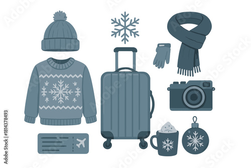 Flat lay of winter travel essentials including warm clothing, suitcase, camera, and holiday accessories