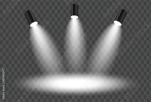 Three bright spotlights illuminating a stage or dark area with visible light beams and a glowing circle on the floor