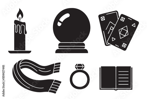 Collection of black silhouette icons related to fortune-telling and mysticism, featuring a crystal ball, tarot cards, a lit candle, a magic book, a ring, and a scarf