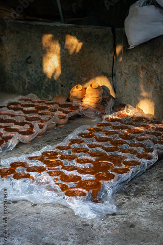 Traditional Molding Process: Terracotta Pots and Plastic-Lined Gur