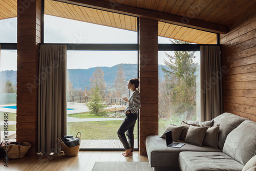 Enjoying a quiet moment indoors while gazing at nature outside