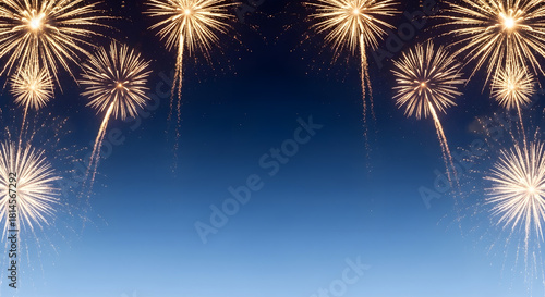 Fireworks display against a blue gradient sky background.