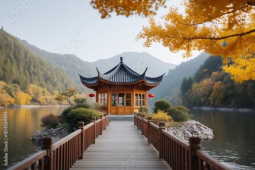 Chinese pavilion with traditional roof over water in scenic mountain garden landscape with trees in autumn color