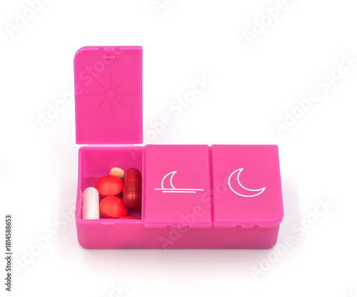 A pill organizer with compartments on a white background. A pillbox for daily medications for maintaining good health.