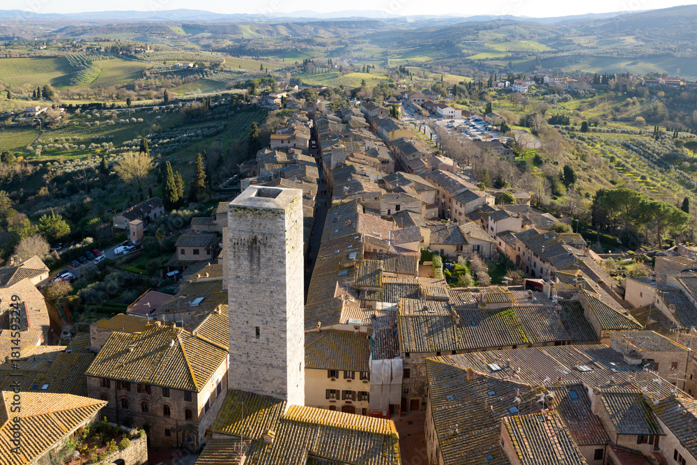 Fototapeta premium Panoramic aerial view from the Torre Grossa overlooking the medieval town of San Gimignano in Tuscany, Italy.