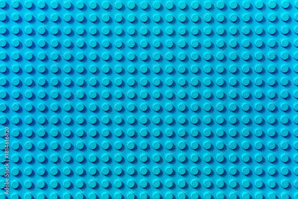 Naklejka premium Turquoise background of the LEGO Classic baseplate