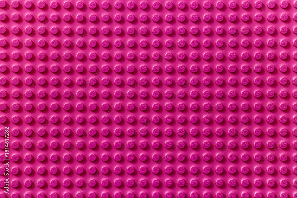 Naklejka premium Lviv, Ukraine - January 4, 2025: Pink background of the LEGO Classic baseplate