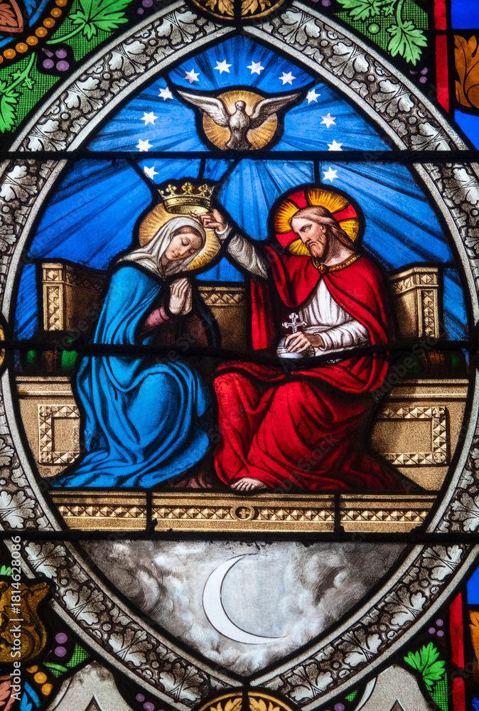 Fototapeta premium Stained glass (19th century) of Coronation of the Virgin Mary, Mother of God, in heaven.