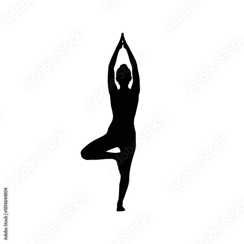 Silhouette of a person performing yoga pose with arms raised and one leg bent in a balanced stance