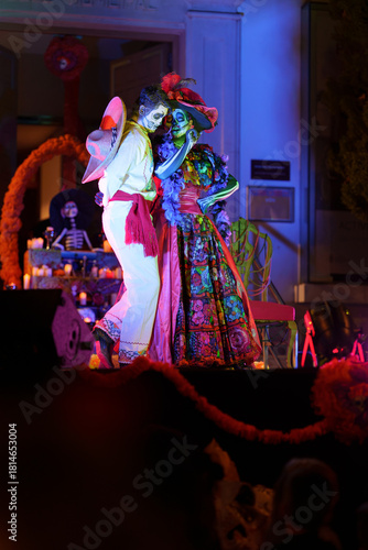 Romantic Day of the Dead Catrin and Catrina Dancing Close on Night Stage