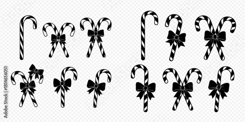 Set of black and white candy canes with bows, isolated on transparent background, for Christmas and holiday designs.