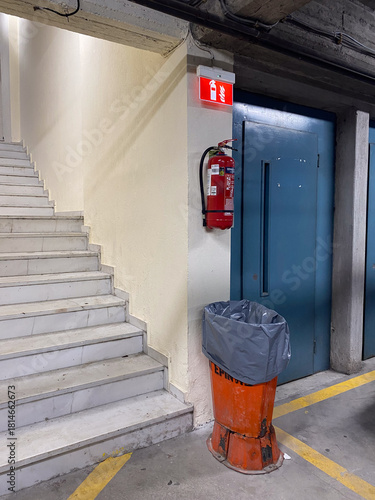 Emergency exit in industrial building with fire safety equipment