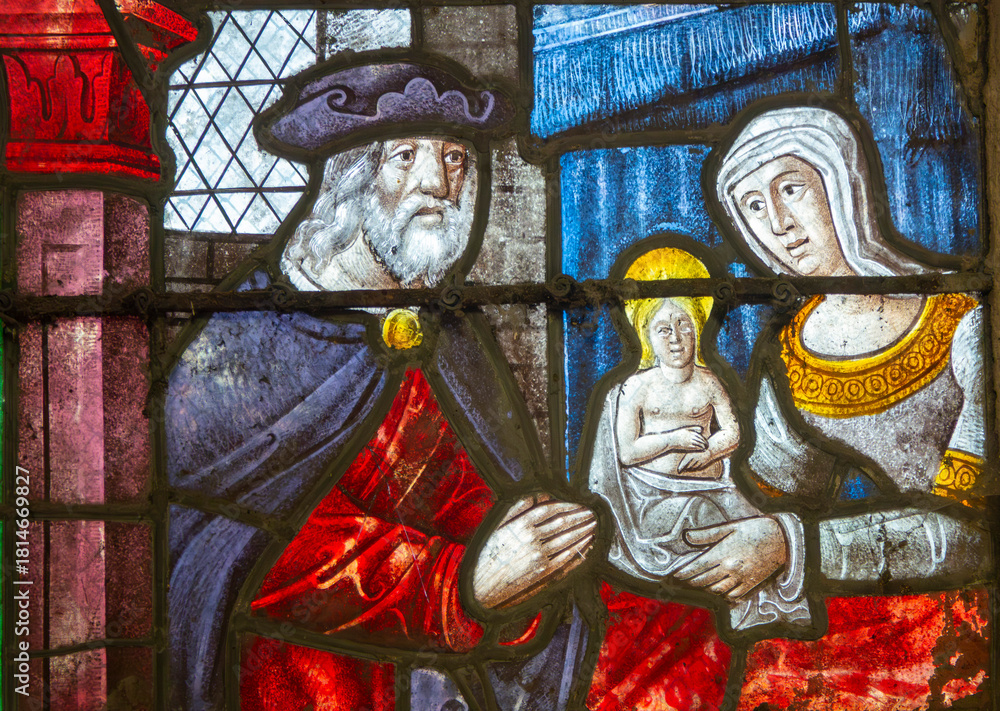 Obraz premium Stained glass (16th century) of the young Virgin Mary with her parents Saint Anne and Saint Joachim.
